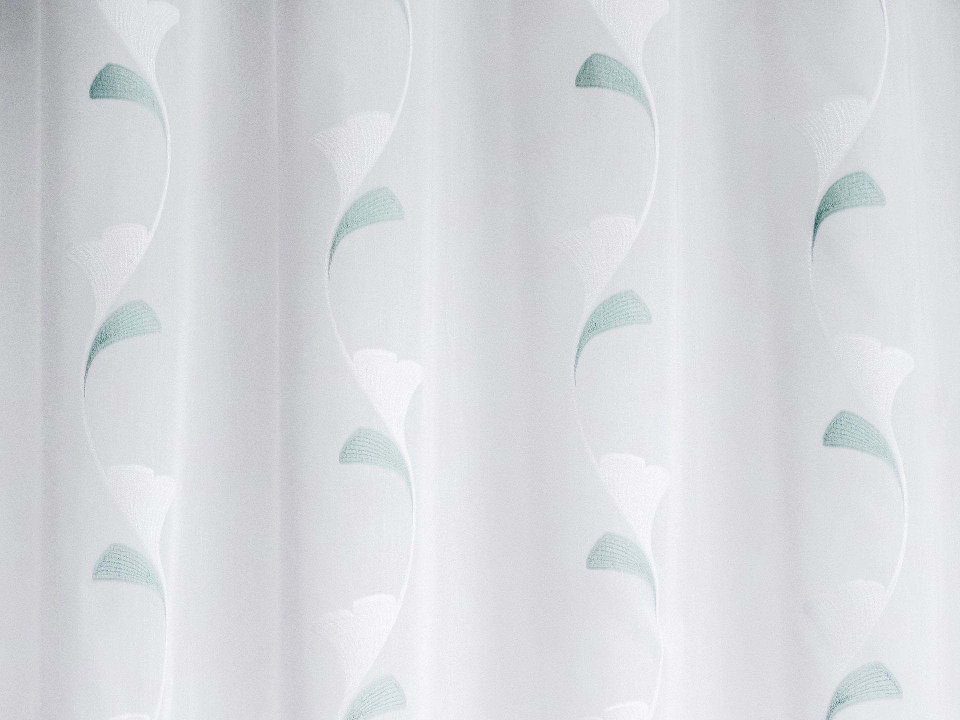Fényáteresztő függöny textil türzkiz levél mintákkal